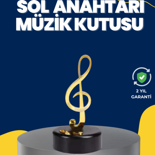Altın renkli sol anahtarı figürüne sahip dönen müzik kutusu